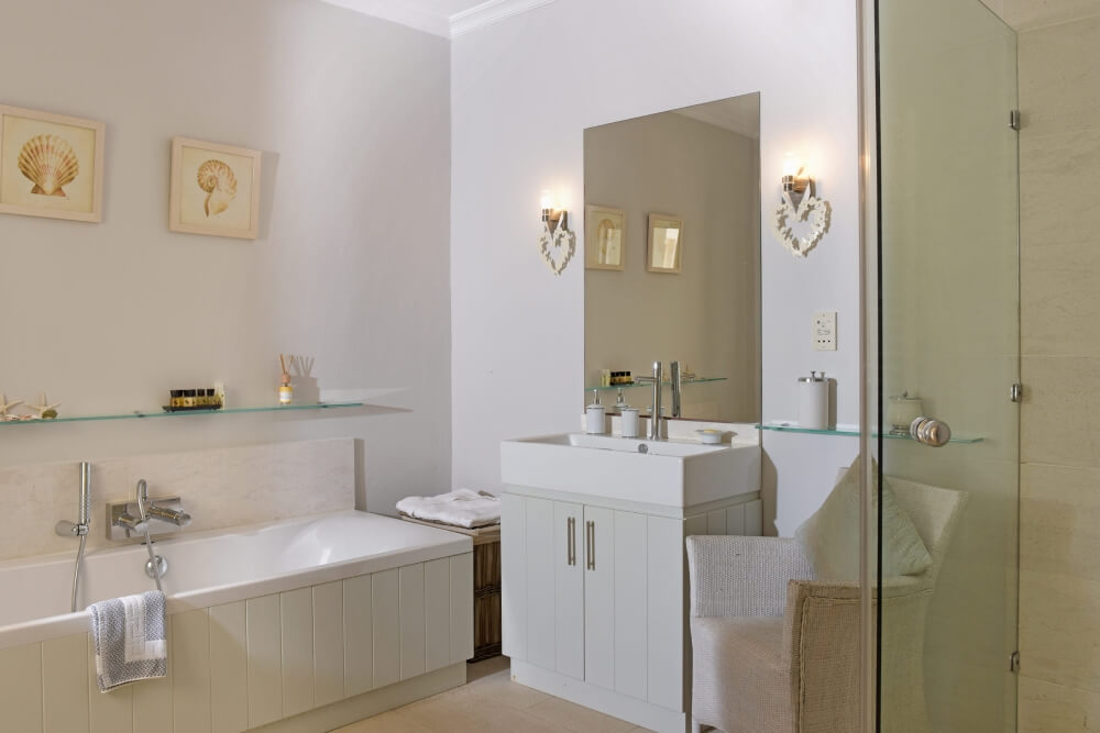 En-suite bathroom at Villa Eremia with freestanding bathtub and bright natural light