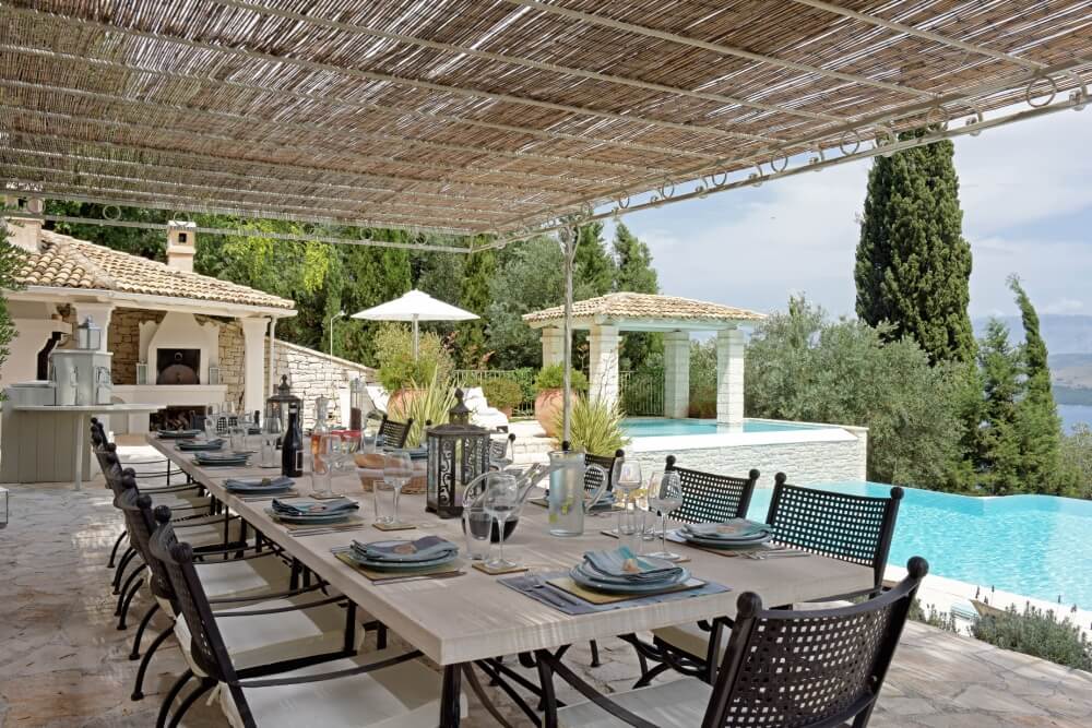 Exterior terrace at Villa Eremia overlooking the infinity pool and the Ionian Sea, North-East Corfu