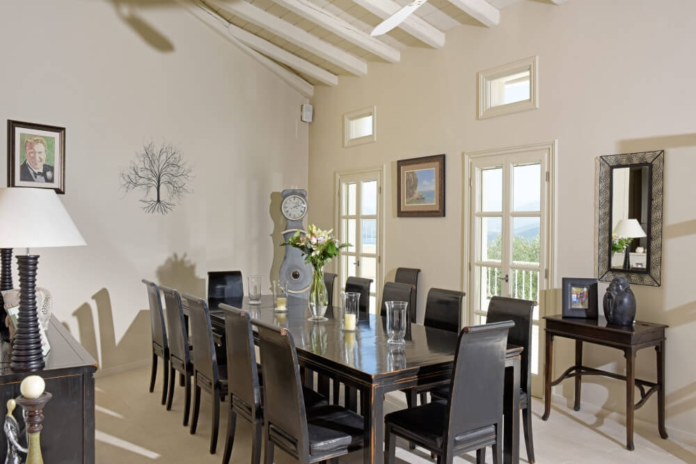 Elegant indoor dining room at Villa Eremia set for a family meal in Corfu