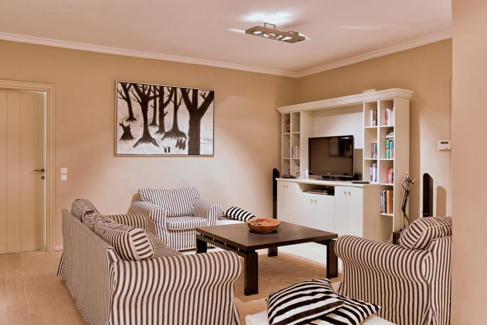 Indoor living room at Villa Eremia with comfortable sofas and Mediterranean styling