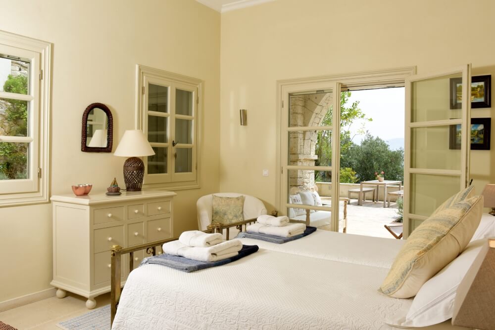 Third guest bedroom at Villa Eremia with comfortable double bed and natural light