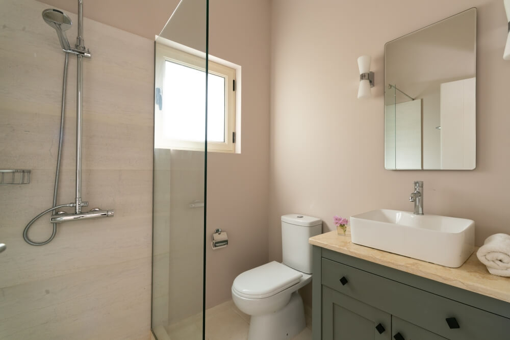 En-suite shower room at Elyonas Cottage with glass walk-in shower and modern fixtures